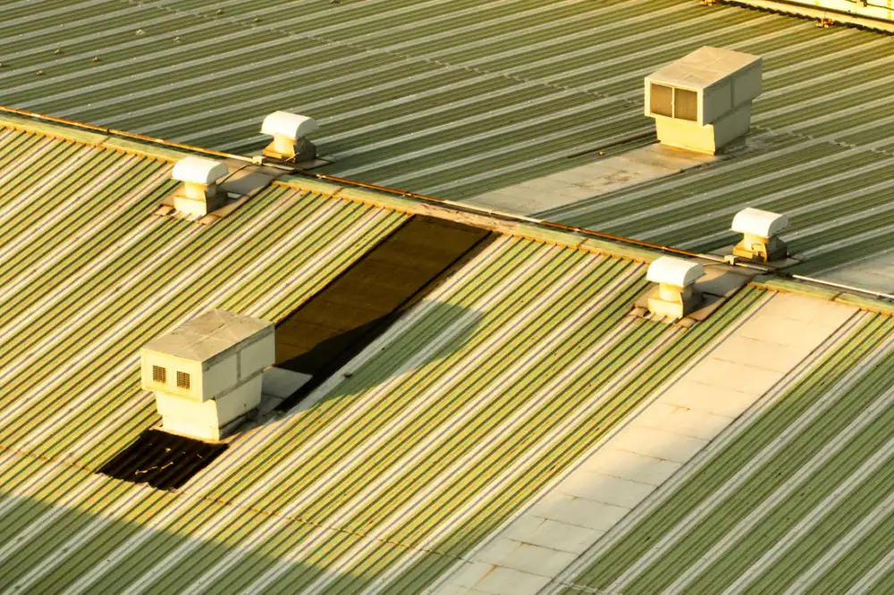 Commercial metal roof with rooftop ventilation units